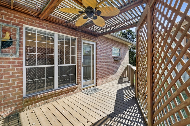 wooden terrace featuring ceiling fan