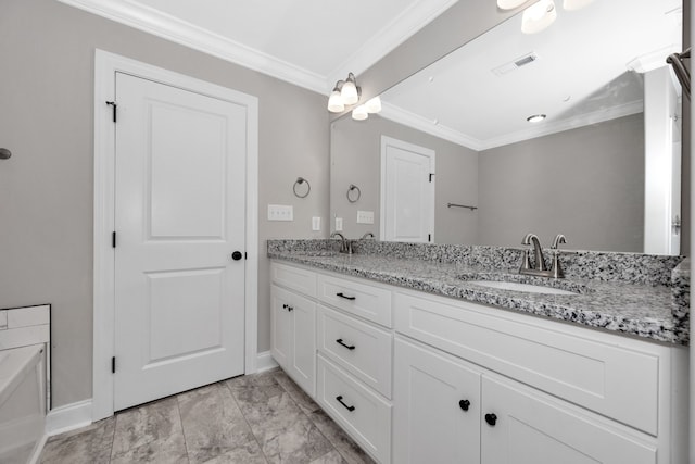 bathroom featuring vanity, crown molding, and a tub