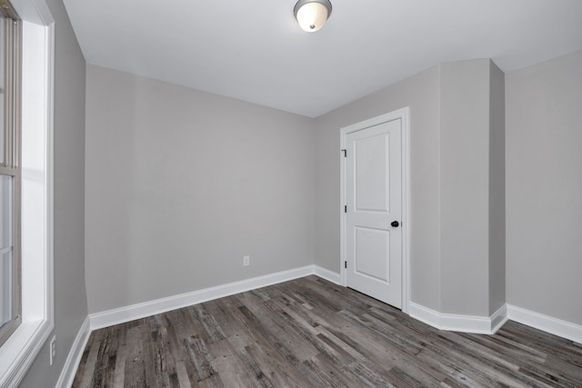 bonus room with dark hardwood / wood-style flooring