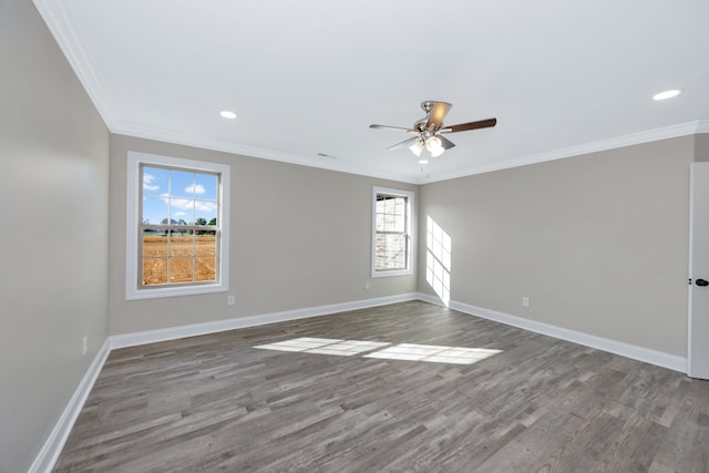 spare room featuring hardwood / wood-style flooring, ornamental molding, and plenty of natural light