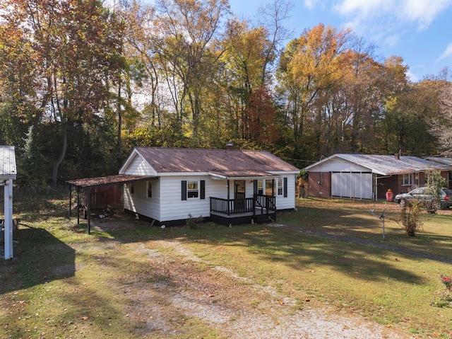 single story home with a front yard and a wooden deck