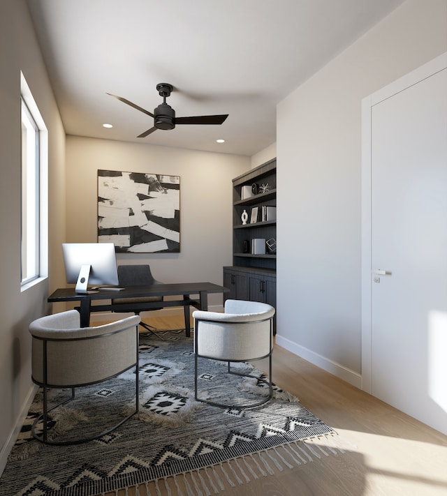 office area featuring wood-type flooring and ceiling fan