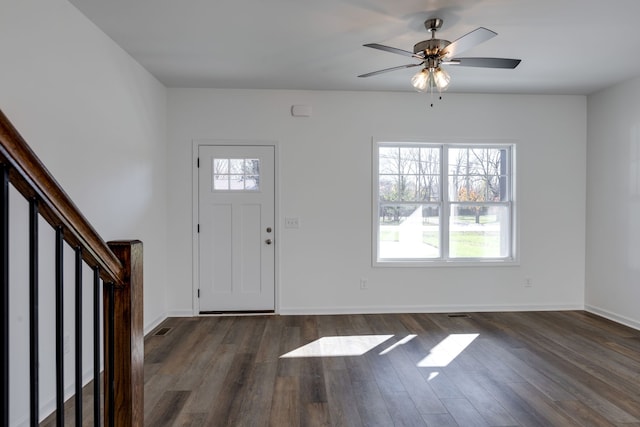 entryway with ceiling fan and dark hardwood / wood-style flooring