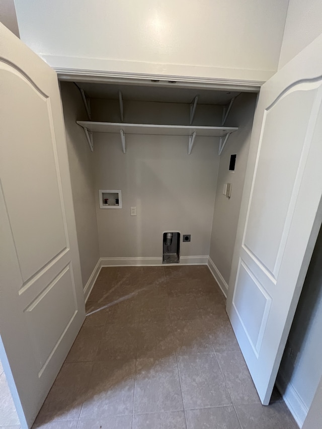 clothes washing area with hookup for an electric dryer, hookup for a washing machine, and tile patterned flooring