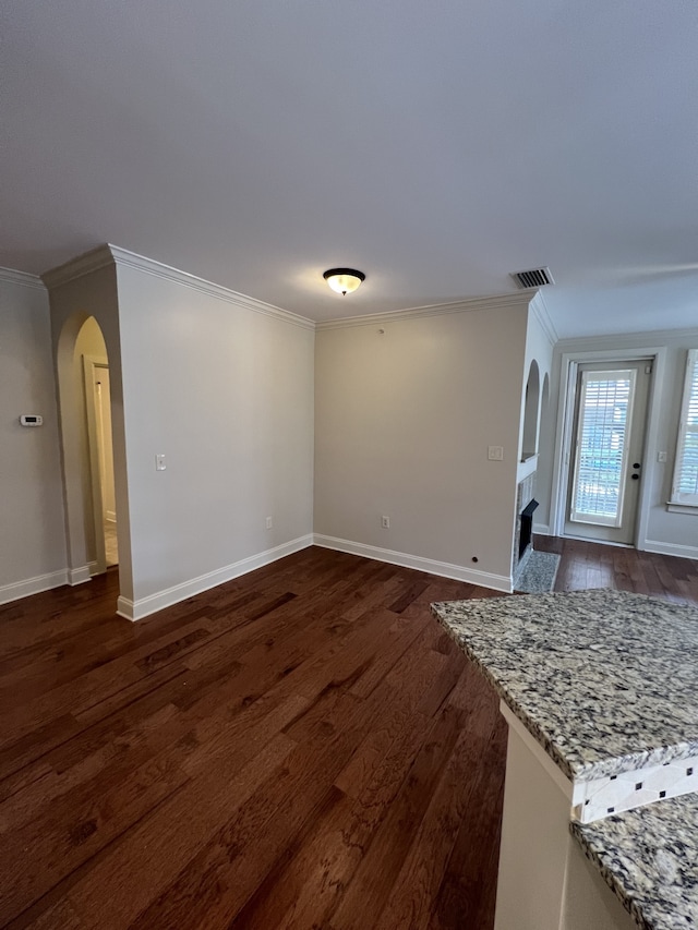 living room with crown molding and dark hardwood / wood-style flooring