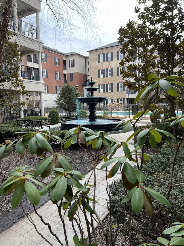 view of home's community with a swimming pool