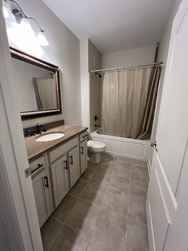 full bathroom featuring vanity, shower / tub combo with curtain, tile patterned flooring, and toilet