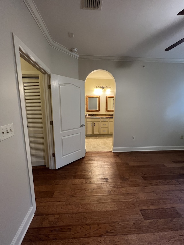 hall with crown molding and dark hardwood / wood-style floors