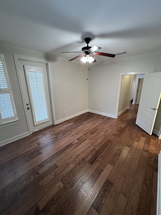 unfurnished room featuring ornamental molding, dark hardwood / wood-style floors, and ceiling fan