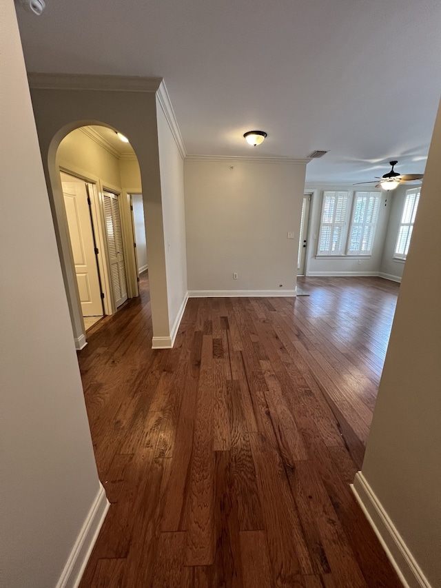 hall with crown molding and dark hardwood / wood-style floors