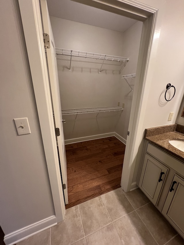 bathroom with vanity and hardwood / wood-style flooring