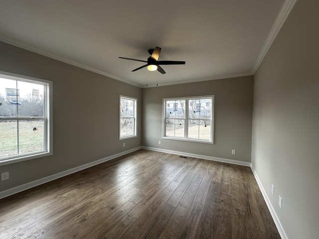 empty room featuring dark hardwood / wood-style floors, ceiling fan, and ornamental molding