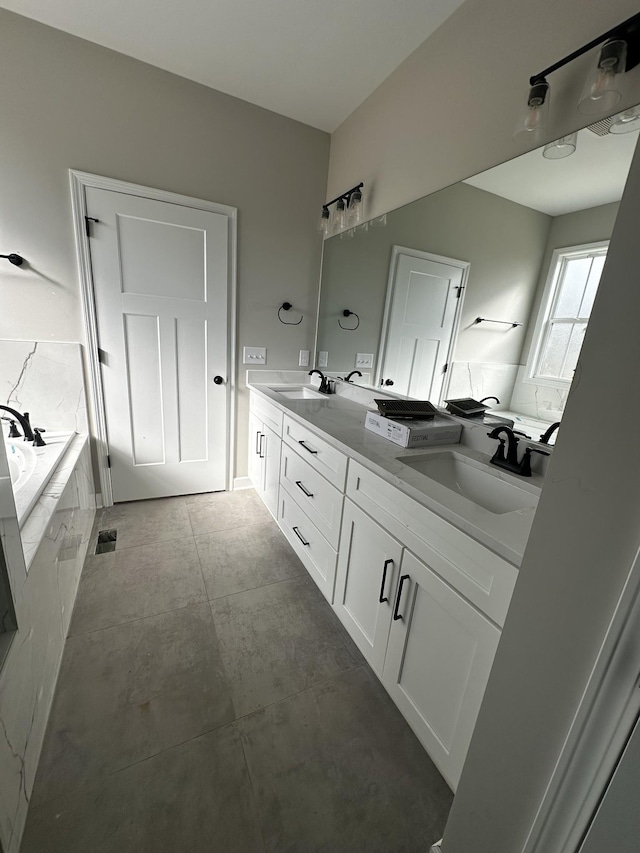 bathroom featuring vanity and tiled bath