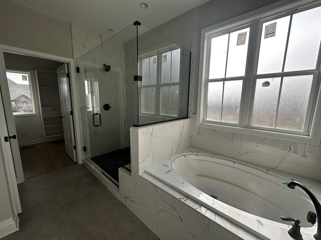 bathroom with independent shower and bath