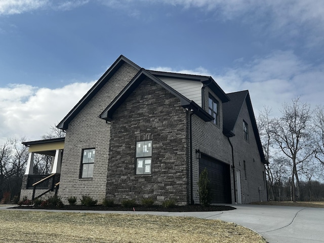 view of side of property featuring a garage