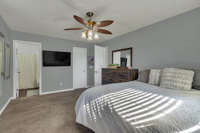 carpeted bedroom with ceiling fan and ensuite bathroom