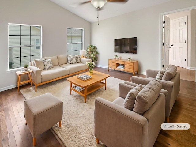 living room with hardwood / wood-style floors, vaulted ceiling, and ceiling fan