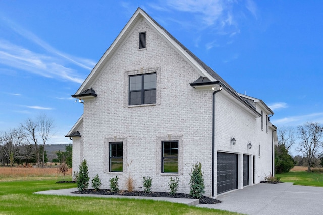 view of property exterior with a garage and a yard