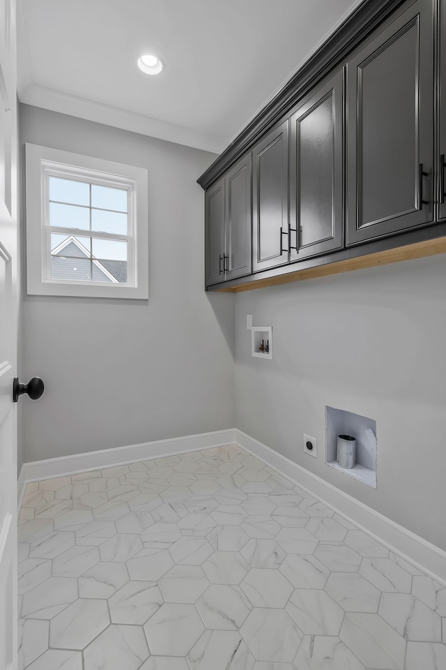 washroom featuring hookup for an electric dryer, cabinets, and washer hookup