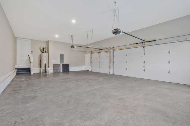 garage featuring electric panel, a garage door opener, and water heater