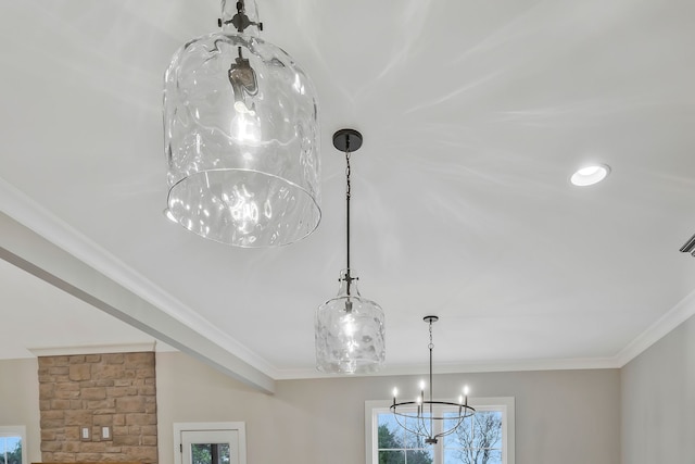 interior details with crown molding and a chandelier