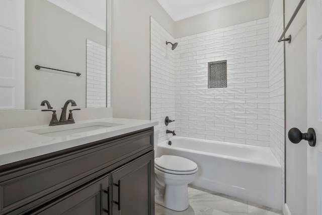 full bathroom featuring vanity, toilet, and tiled shower / bath