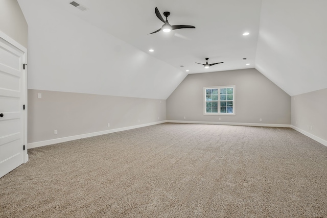 additional living space featuring ceiling fan, carpet floors, and vaulted ceiling