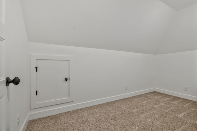 bonus room featuring carpet floors and lofted ceiling