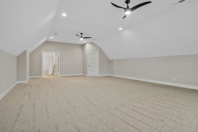 bonus room with ceiling fan, light carpet, and vaulted ceiling