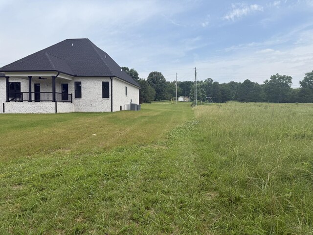 2120 Hamilton Chambers Rd, Lebanon, TN 37087 - view of grassy yard featuring cooling unit and ceiling fan