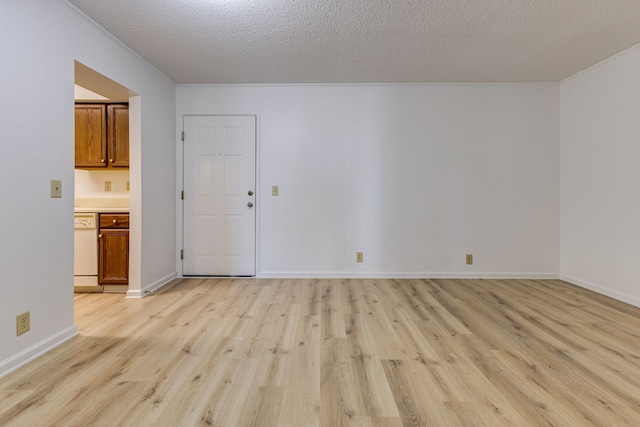 unfurnished room featuring a textured ceiling and light hardwood / wood-style floors