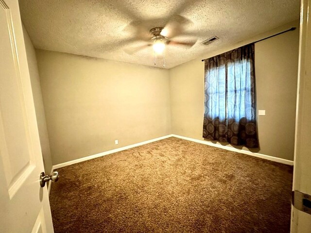 286 Nichols Rd, Pembroke, KY 42266 - unfurnished room featuring ceiling fan, carpet flooring, a textured ceiling, and baseboards