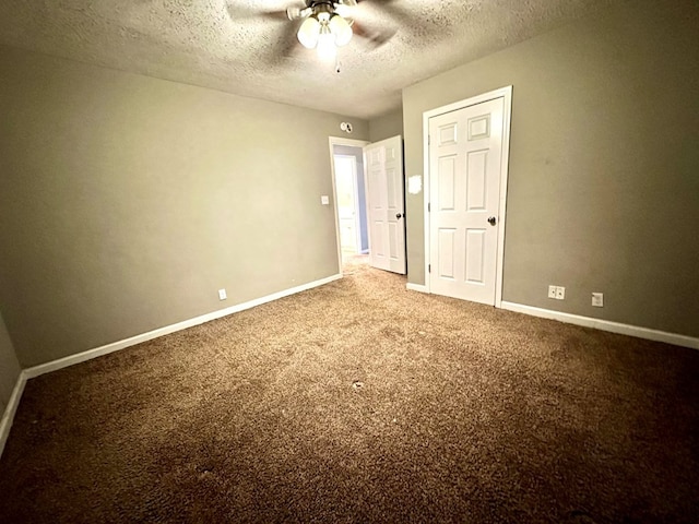 unfurnished bedroom with ceiling fan, carpet floors, and a textured ceiling