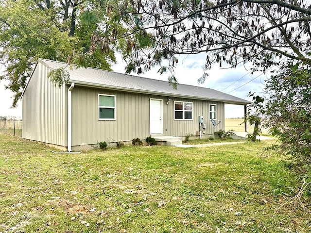286 Nichols Rd, Pembroke, KY 42266 - view of front of property featuring a front yard, metal roof, and board and batten siding