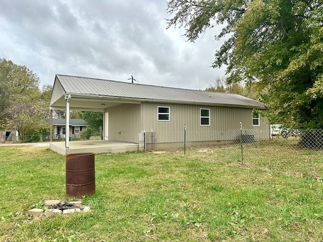 rear view of property with a patio area and a lawn