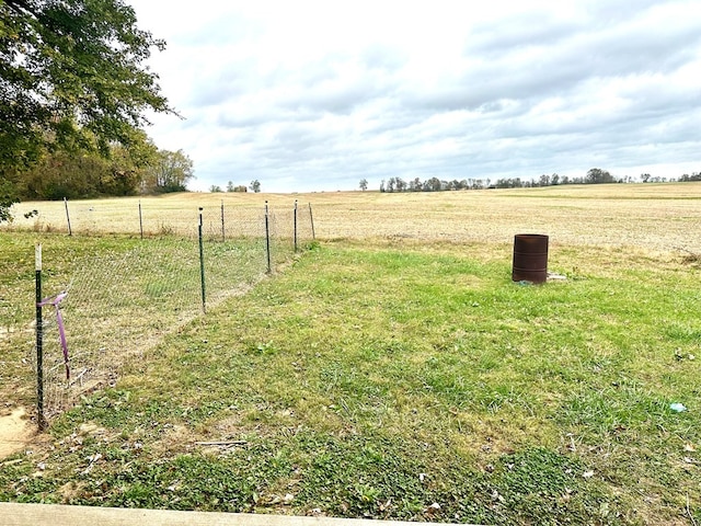 view of yard with a rural view