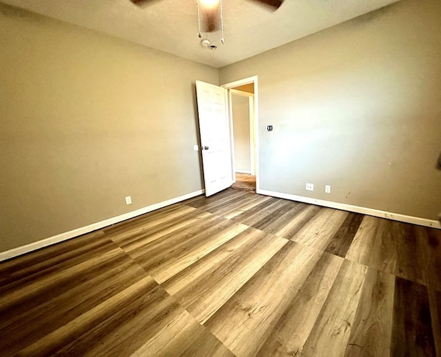 empty room featuring hardwood / wood-style floors and ceiling fan