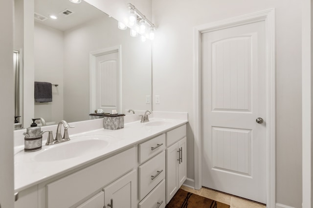 bathroom with vanity and tile patterned flooring