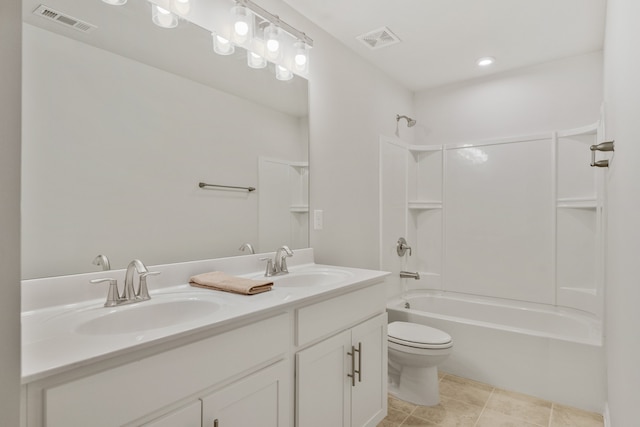 full bathroom featuring vanity, washtub / shower combination, toilet, and tile patterned flooring