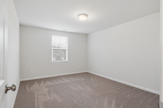 empty room with carpet flooring