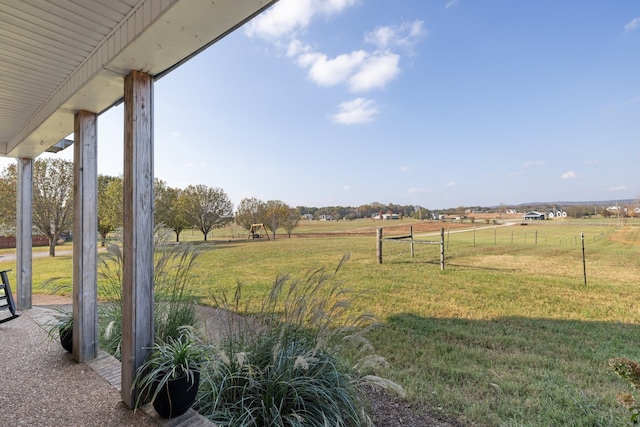 view of yard with a rural view