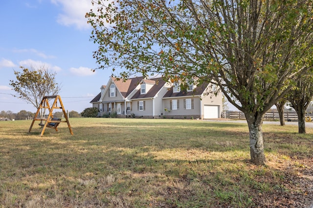 view of front of home featuring a front lawn and a garage