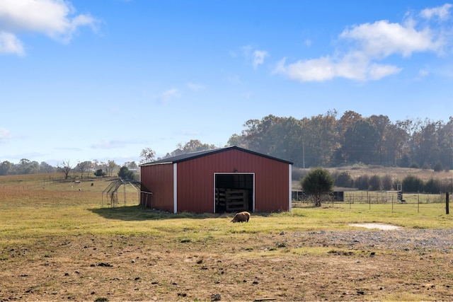 view of outbuilding with a rural view