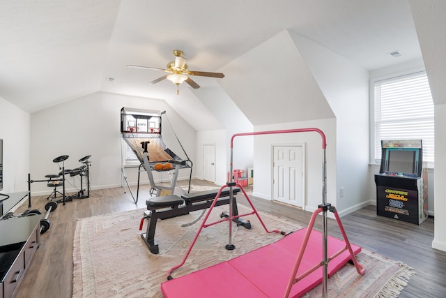 exercise room with lofted ceiling, wood-type flooring, and ceiling fan