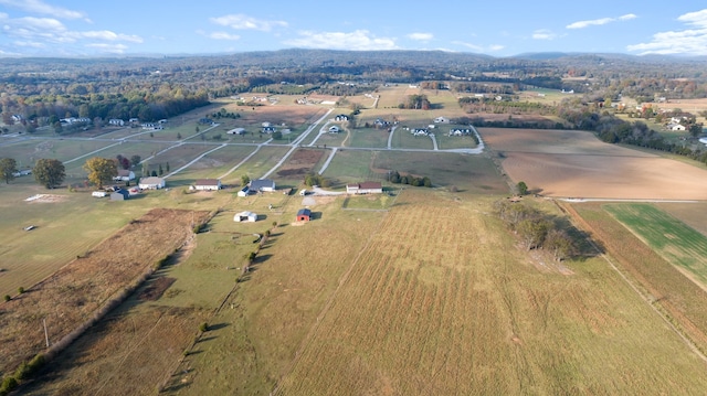 birds eye view of property with a rural view