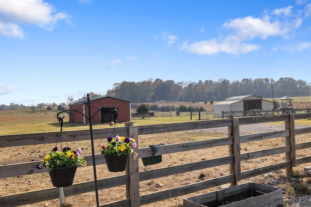 view of yard with a rural view