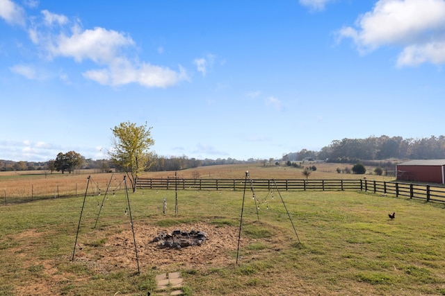 view of yard with a rural view