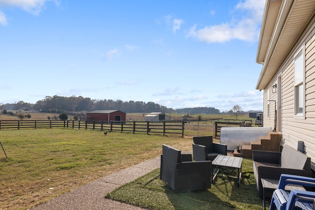 view of yard with a rural view