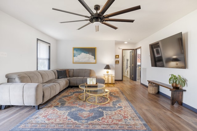 living room with ceiling fan and hardwood / wood-style flooring