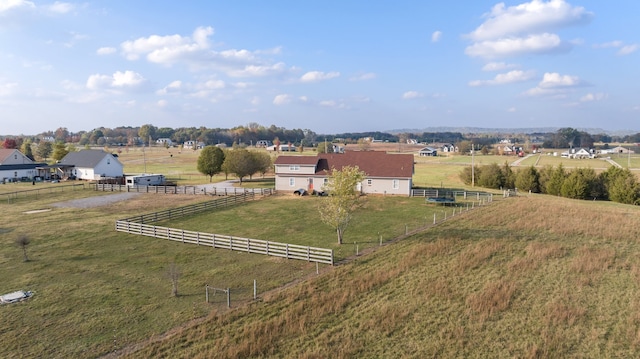 birds eye view of property with a rural view